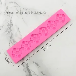 Pink silicone mold for cake borders with geometric rectangle and cylinder designs