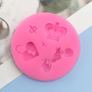 Pink silicone mold with key, crown, heart lock, and motorcycle shapes for DIY cakes