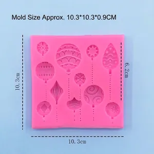 Pink silicone mold with 10 Christmas ball patterns for fondant cake decoration