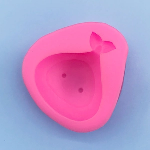 Macro detail of the pink silicone onion shape mold for DIY clay and chocolate crafts