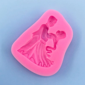 Detail view of pink silicone mold showing the dancing bride and groom wedding design