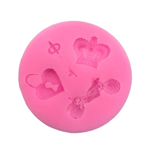 Pink silicone mold with heart, crown, key, and motorcycle shapes for DIY cake fondant