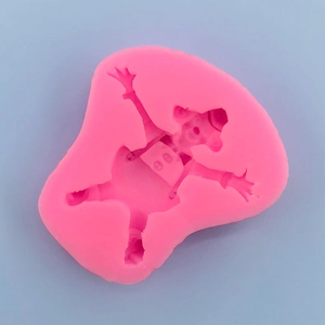 Detailed pink silicone mold featuring a cartoon bear with hat for fondant and chocolate
