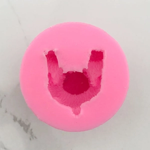 Macro shot of pink silicone mold with a rabbit character design for cake decorating