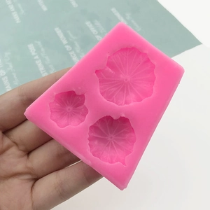 Pink silicone mold featuring three distinct lotus leaf shapes for cake and DIY crafts