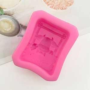 Detail of pink silicone 3D cartoon cow mold with Milk text for chocolate and baking