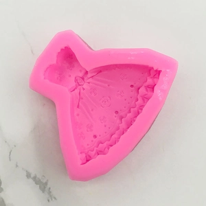 Top view of pink silicone mold with detailed rose textures and wedding dress pleats