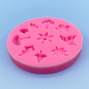 Pink silicone mold with flower and leaf patterns for fondant cake decoration