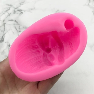Pink silicone mold with facial features for Christmas Santa fondant and cake decorating