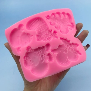 Pink silicone Christmas mold with Santa, tree, and reindeer for fondant and baking