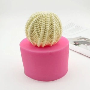 Pink silicone mold for DIY wool ball soaps with realistic textured finished product