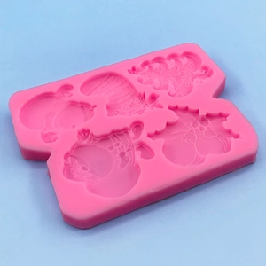 Pink silicone Christmas mold with snowman tree and sock shapes for fondant cake baking