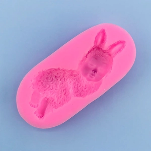 Detailed macro view of pink silicone mold with sleeping baby bunny texture for baking