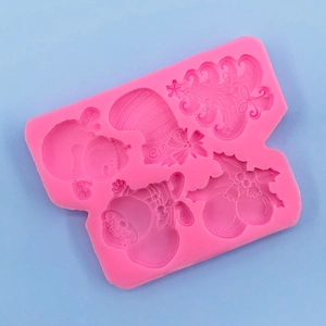 Detailed pink silicone mold featuring Christmas tree, snowman and Santa Claus shapes