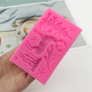 Pink silicone Christmas mold with reindeer and snowflakes for DIY cake decorating