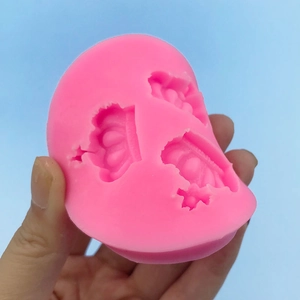 Pink silicone crown mold for DIY cake decorating and fondant with three crown designs