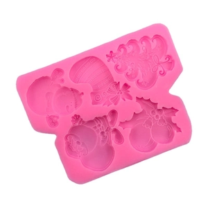 Pink silicone Christmas mold with snowman, sock, tree, and holly for fondant and chocolate