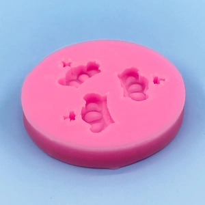 Pink silicone mold featuring triple crown and star designs for DIY cake fondant and chocolate