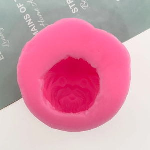Detailed close-up of pink silicone mold with intricate lion face relief for DIY fondant