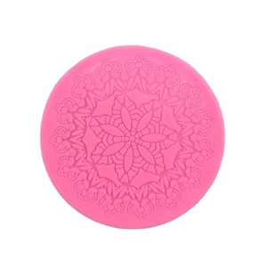 Pink round silicone mold featuring detailed mandala lace flower relief for cake baking
