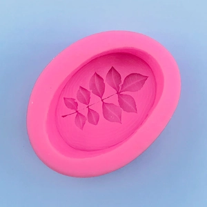Macro detail of pink silicone leaf mold for soap and chocolate cake decoration