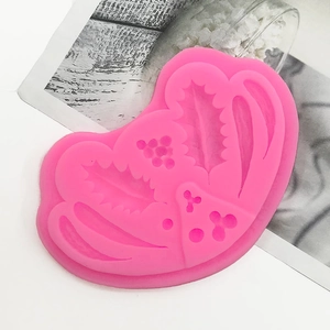 Detailed pink silicone holly leaf and berry mold for Christmas fondant cake decoration