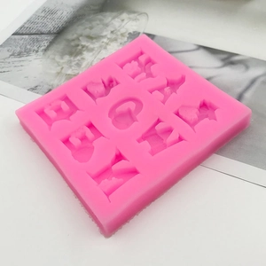 Pink silicone Halloween fondant mold with ghost pumpkin and witch hat shapes