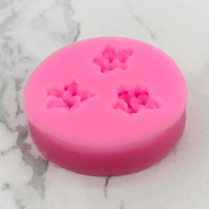 Stampo tondo in silicone rosa con tre cavità a forma di stella per decorare dolci