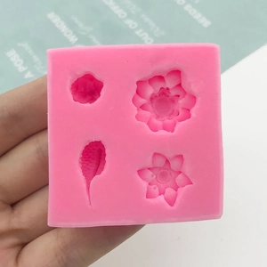 Pink silicone mold featuring 3D lotus flower and koi fish patterns for fondant cakes