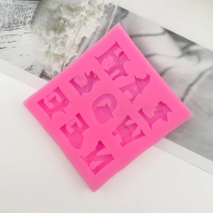 Pink silicone mold with Halloween letters pumpkin and witch hat shapes for cake decoration
