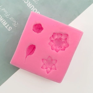 Detail of pink silicone mold with 3D lotus and leaf textures for fondant and chocolate