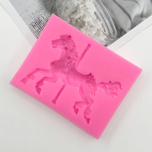 Detailed view of pink silicone carousel mold for fondant cake and soap making