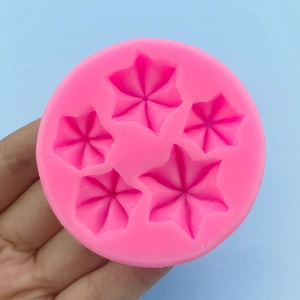 Handheld pink silicone star flower mold for cake decorating and DIY baking tools
