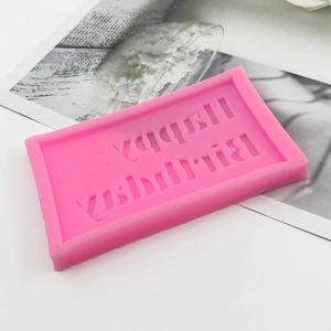 Pink silicone mold featuring Happy Birthday letters for DIY chocolate and cake decoration