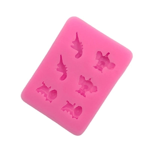 Pink silicone mold with 6 cavities featuring cartoon elephants and dinosaurs for DIY baking
