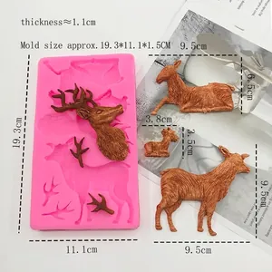 Pink silicone mold featuring three reindeer designs for DIY Christmas cake and chocolate making