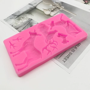 Pink silicone mold featuring various reindeer shapes for DIY Christmas cake and fondant