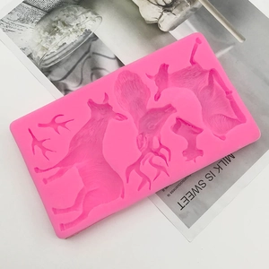 Detail showing pink silicone reindeer molds with various elk shapes for DIY baking crafts