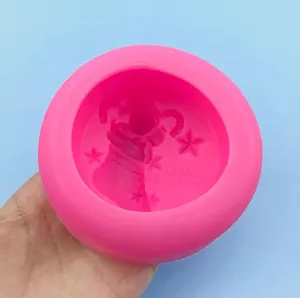 Pink silicone mold featuring Merry Christmas socks and stars for DIY soap and plaster