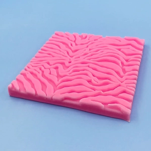 Pink rectangular silicone texture mat with embossed zebra pattern for cake fondant decorating