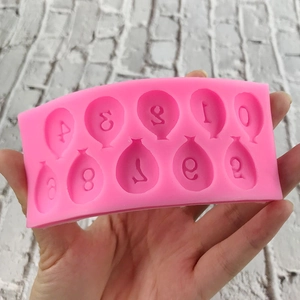 Pink silicone mold featuring balloon shaped numbers 0-9 for DIY cake and chocolate decoration