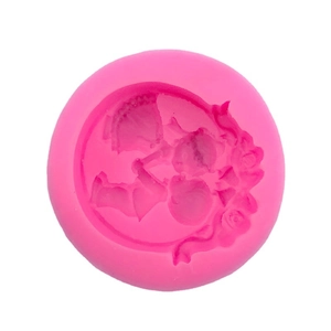 Pink silicone mold for DIY soap and cake featuring intricate relief floral designs