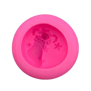 Pink silicone Merry Christmas mold with 3D star and festive stocking patterns