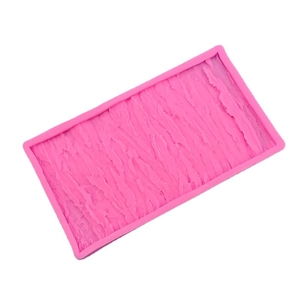 Pink silicone mold featuring realistic tree bark texture for cake and chocolate decorating