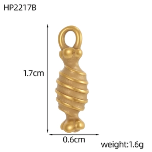 Macro detail of a 1.7cm golden spiral pendant with dimensions and product specifications