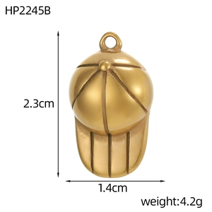 Macro detail of a 2.3cm vintage gold baseball cap pendant with detailed engraving