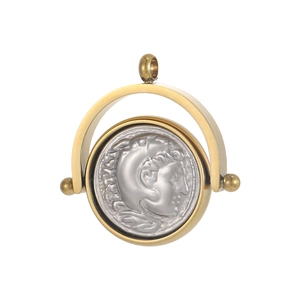 Macro view of rotating vintage stainless steel coin pendant with relief portrait