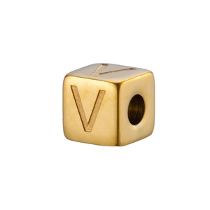 Macro detail of a 14K gold plated stainless steel cube bead with engraved letter V
