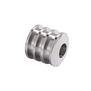 Close-up of cylindrical stainless steel jewelry spacer bead with three-groove detail