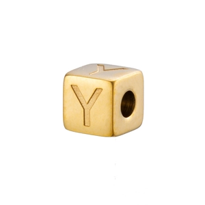 Detail of a 14K gold-plated cube charm with an engraved letter Y for DIY jewelry making